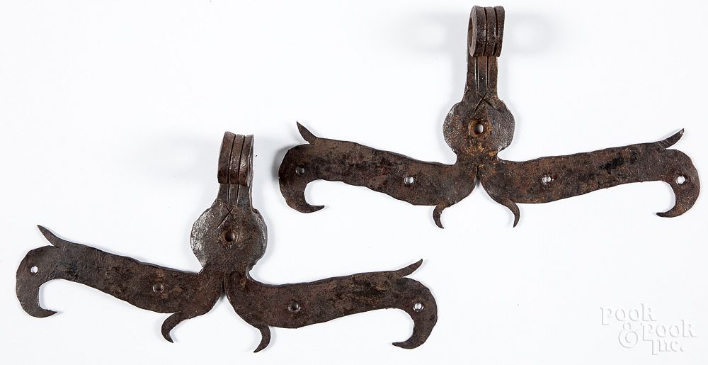 Appraisal: Pair of wrought iron ram's horn hinges Pair of wrought