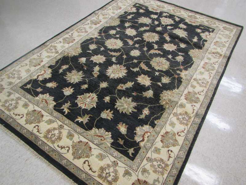 Appraisal: HAND KNOTTED ORIENTAL CARPET Persian Isfahan design featuring a floral