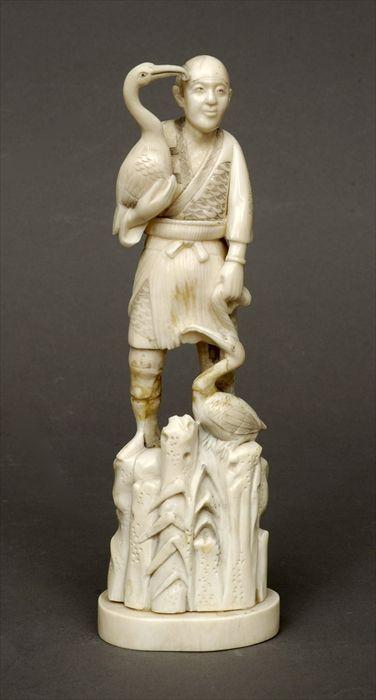 Appraisal: Japanese Faux Ivory Group of a Man with Two Pelicans