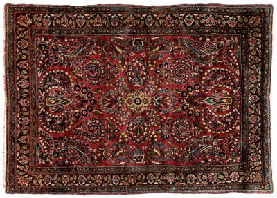 Appraisal: Sarouk rug repeating floral designs on burgundy field ft in