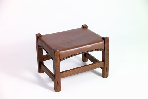 Appraisal: GUSTAV STICKLEY Footstool with arched aprons tacked-on leather covering and