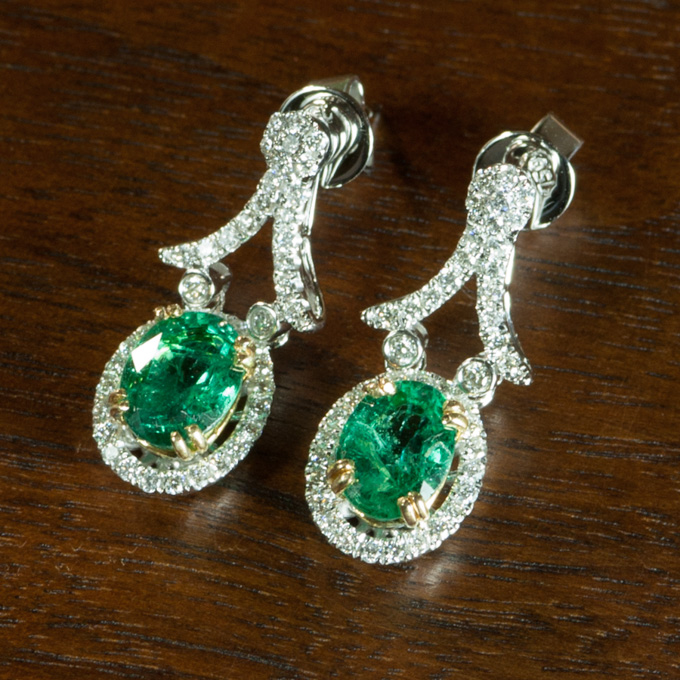 Appraisal: PAIR OF EMERALD AND DIAMOND EARRINGS each k white and