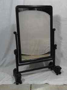 Appraisal: A Chinese hardwood dressing table mirror the rectangular swing mirror