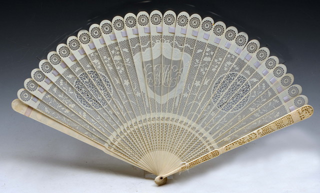 Appraisal: A CHINESE CANTON IVORY BRISE FAN with monogram within a