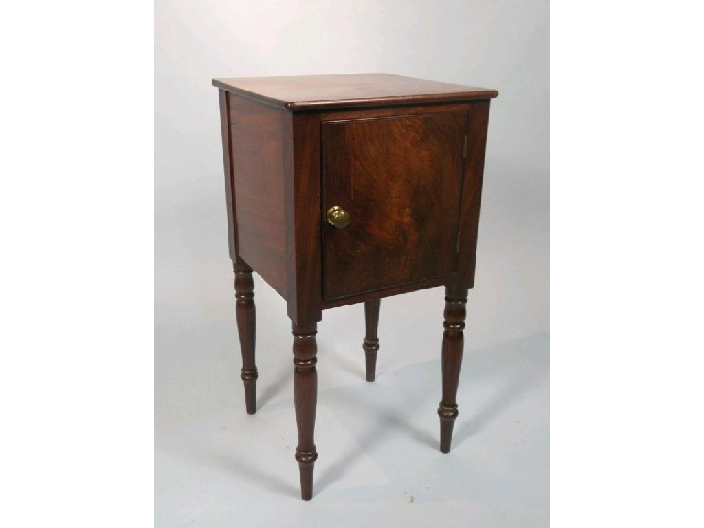 Appraisal: A early thC mahogany bedside cupboard with a single door