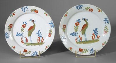 Appraisal: Pair Delft heron plates each featuring crested heron and boldly