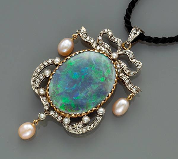 Appraisal: An opal diamond and cultured pearl pendant mounted in silver-topped