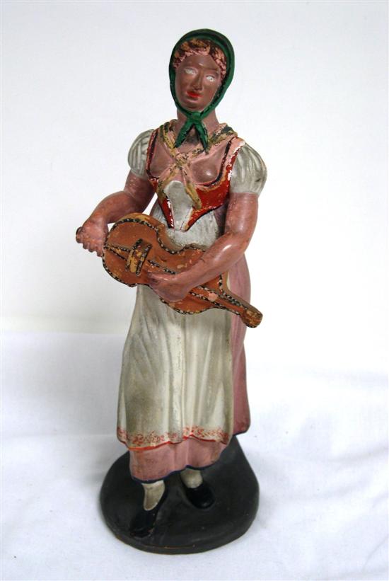 Appraisal: th C Portuguese terracotta figure of woman in regional dress