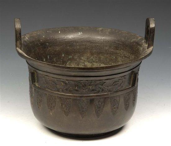 Appraisal: AN ANTIQUE CHINESE BRONZE TWO HANDLED CENSER with mythological creature