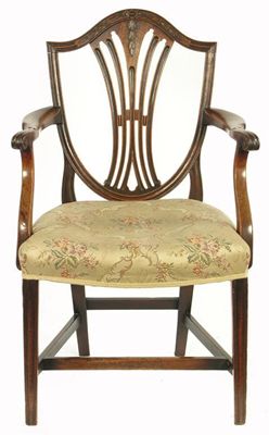 Appraisal: A late George III mahogany open armchair the shield shape