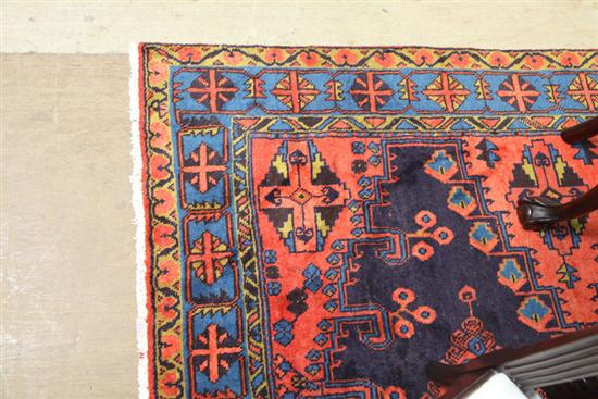 Appraisal: ORIENTAL STYLE RUG Red and blue ground with central medallion