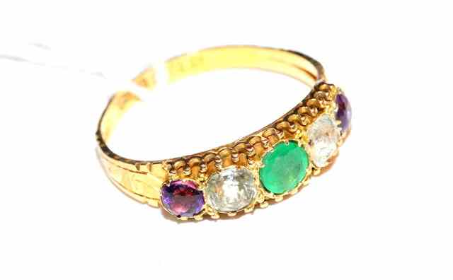 Appraisal: A FIVE STONE SET DRESS RING set with an emerald