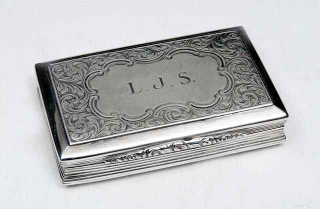 Appraisal: A VICTORIAN SILVER RECTANGULAR SNUFF BOX with waisted reeded sides