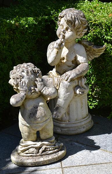 Appraisal: TWO CONCRETE GARDEN CHERUBS