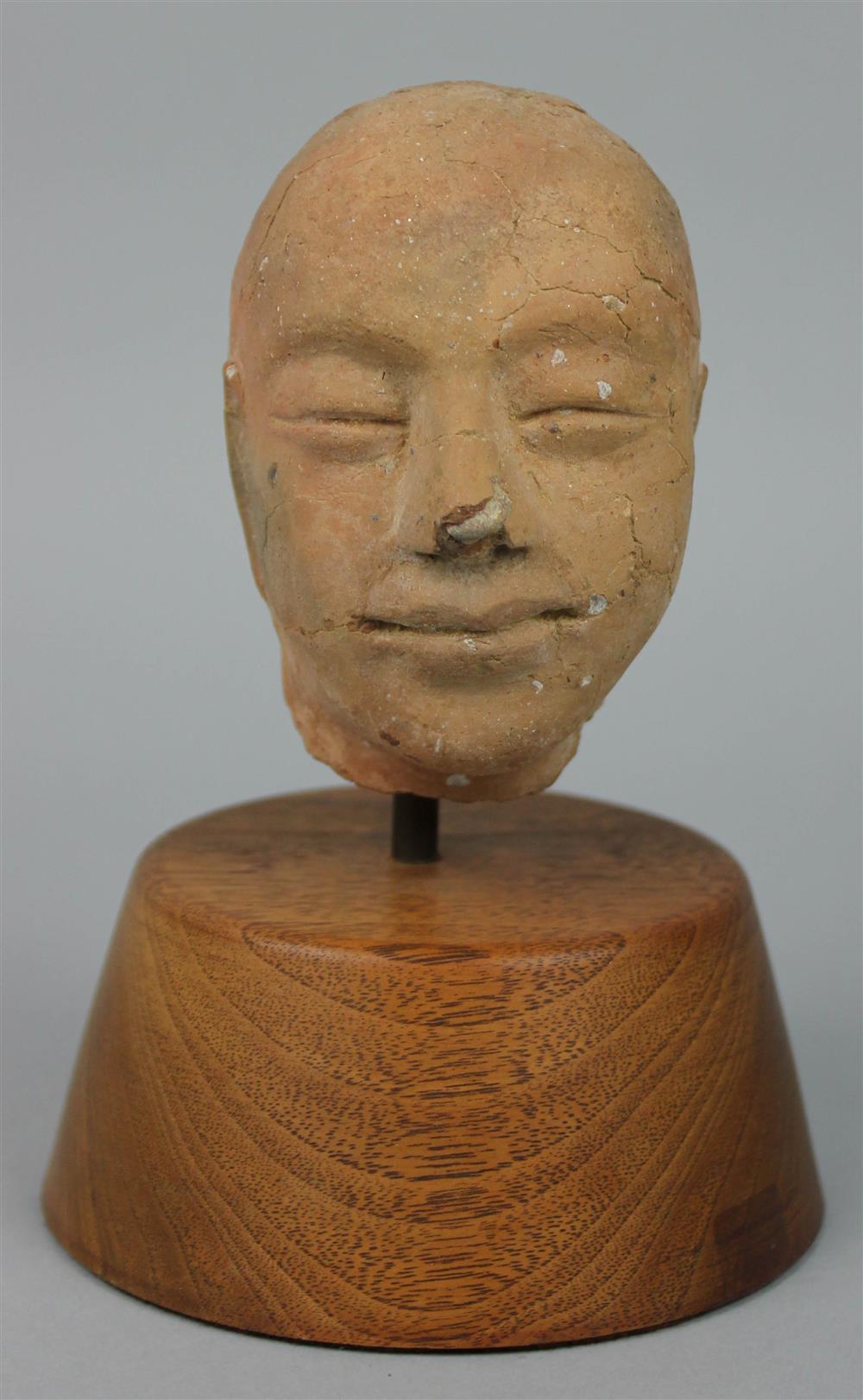 Appraisal: CHINESE SMALL POTTERY HEAD OF THE BUDDHA MING DYNASTY the