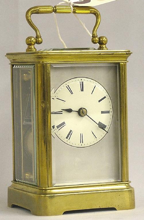 Appraisal: Small carriage clock striking on a gong the cream dial