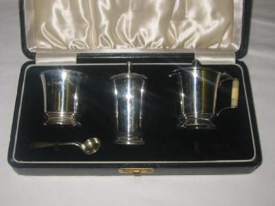 Appraisal: AN ART DECO THREE PIECE CRUET SET of tapering circular