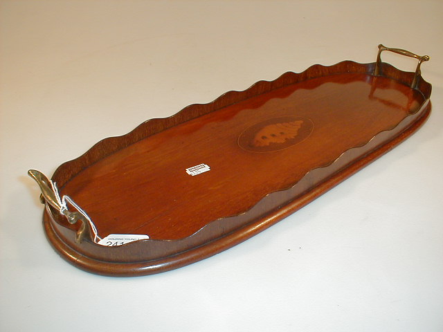 Appraisal: A small inlaid mahogany oval two-handled gallery tray with shell