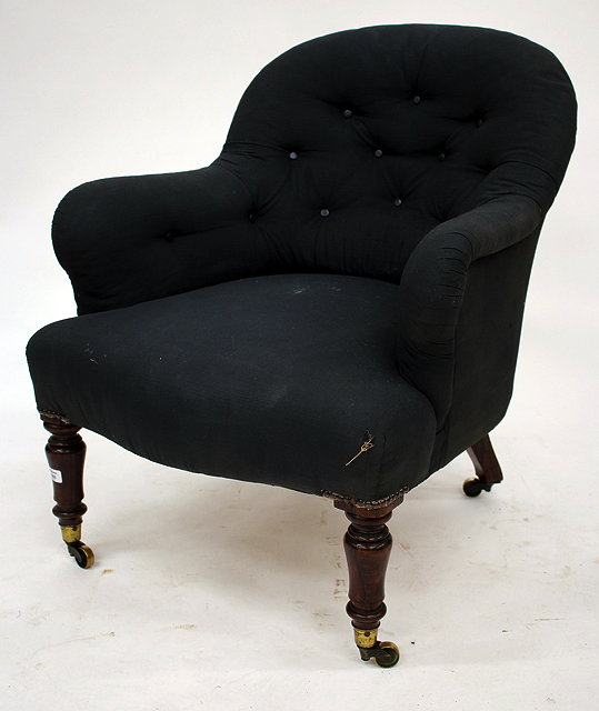 Appraisal: A VICTORIAN BUTTON BACK UPHOLSTERED NURSING CHAIR with turned rosewood