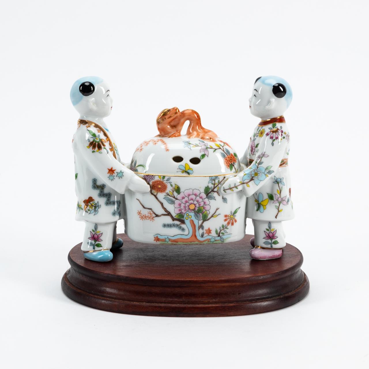 Appraisal: FIGURAL PORCELAIN POTPOURRI BOX ON WOOD STAND Chinoiserie porcelain lidded