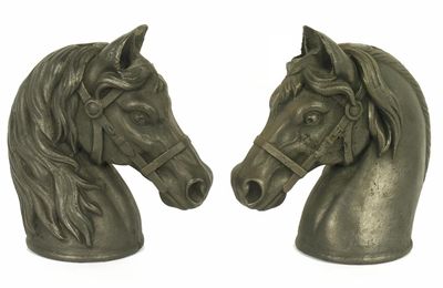 Appraisal: A pair of cast iron models of horse's heads modern