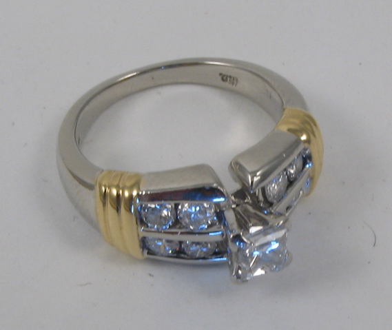 Appraisal: DIAMOND AND EIGHTEEN KARAT GOLD RING centering a princess-cut diamond