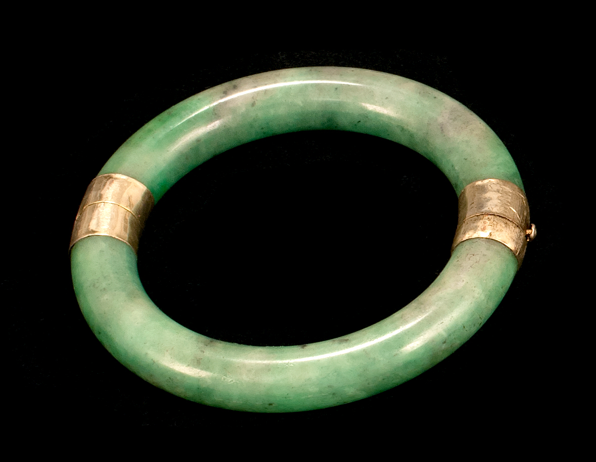 Appraisal: HINGED GREEN JADE BANGLE BRACELET Exterior diameter cm interior diameter