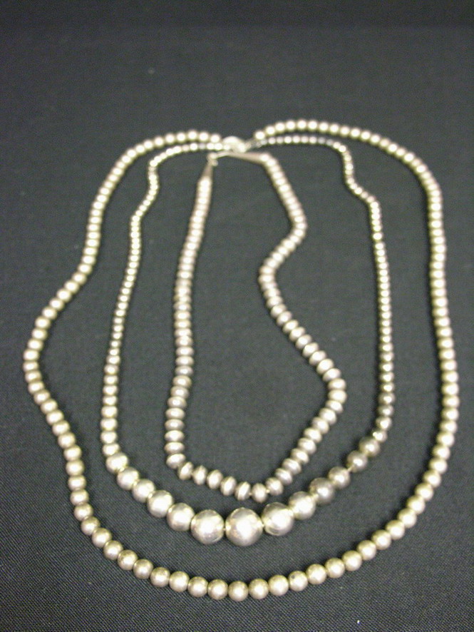 Appraisal: THREE SILVER BEADED NECKLACES Unmarked Probably Indian or Mexican sterling