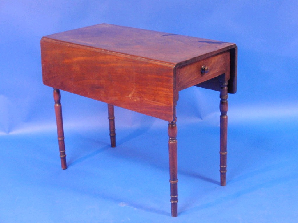 Appraisal: A George III mahogany Pembroke table with frieze drawer and