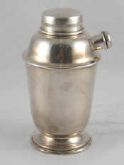 Appraisal: A silver plated cocktail shaker with pouring spout ht cm