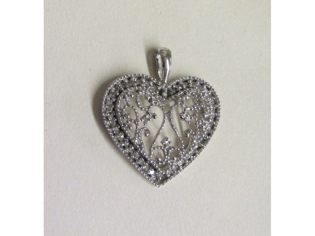 Appraisal: Nine carat white gold diamond set heart shaped pendant