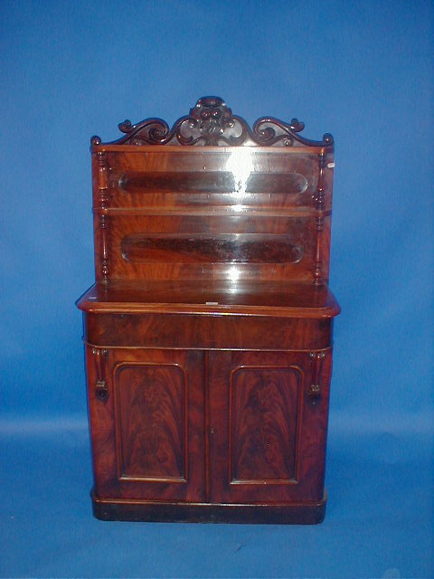 Appraisal: A Victorian flamed mahogany chiffonier with double shelf back rounded