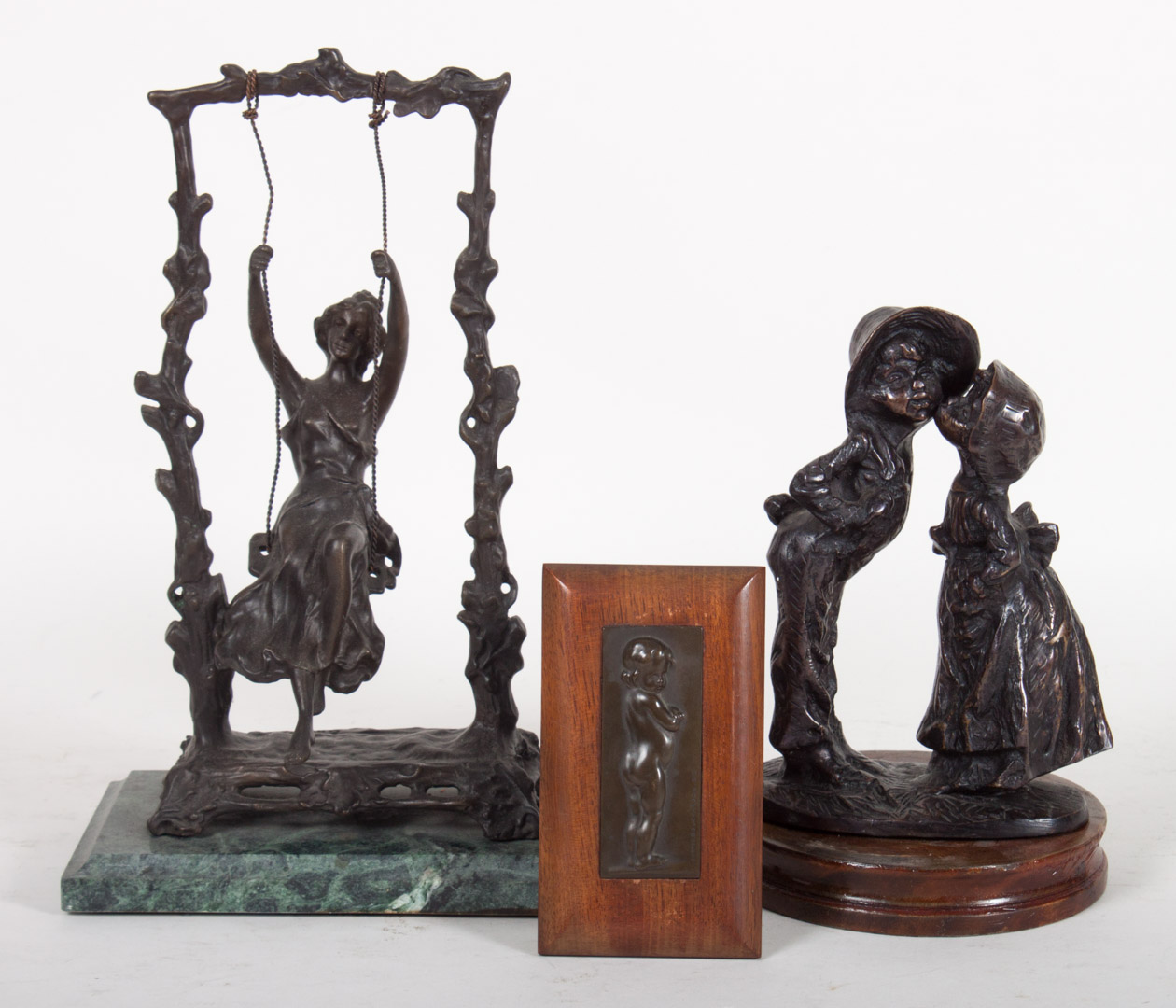 Appraisal: Three Continental bronzes Kissing peasant children mounted on wood base