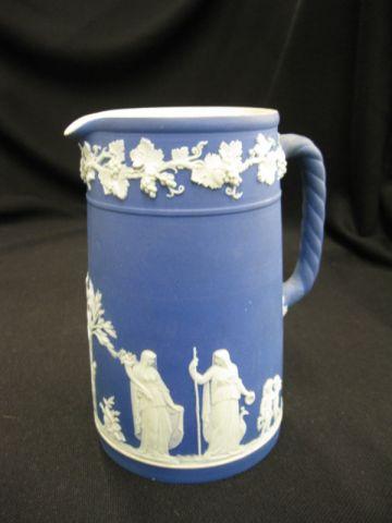 Appraisal: Wedgwood Dark Blue Jasperware Pitcher classical maiden cherub scenes excellent