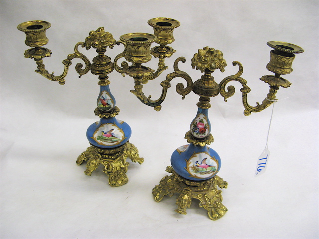 Appraisal: PAIR OF ROYAL VIENNA PORCELAIN GILT METAL CANDELABRA having cartouches