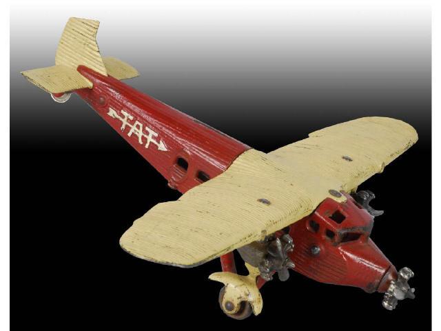 Appraisal: Cast Iron Kilgore Tri-motor Airplane Toy Description Painted red cream