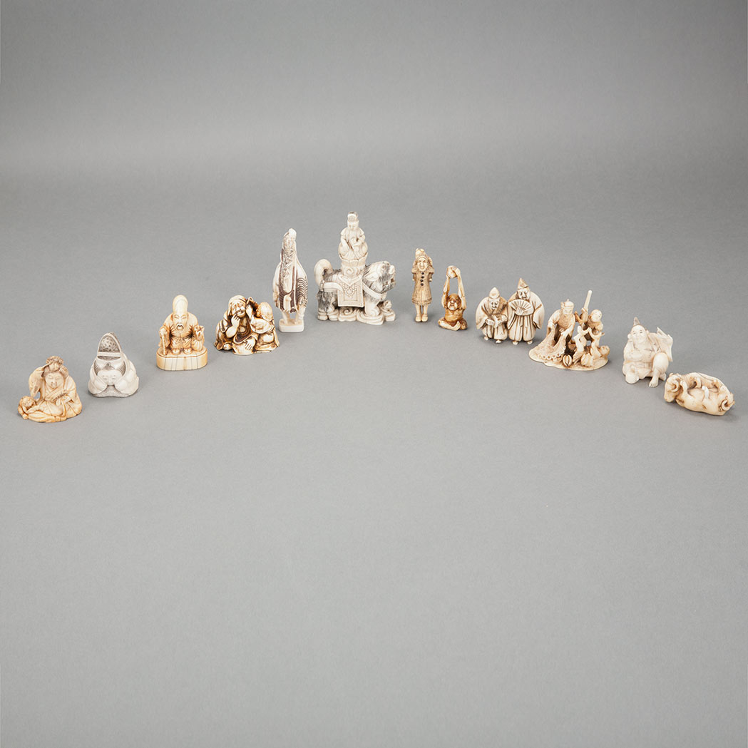 Appraisal: Group of Twelve Japanese Ivory Netsuke Including figural groups and