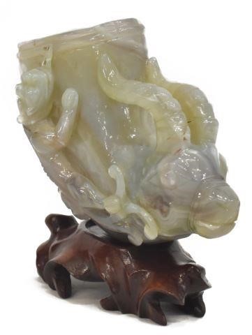 Appraisal: Chinese carved agate ram's head libation cup one side with