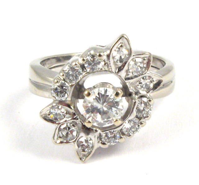 Appraisal: DIAMOND AND FOURTEEN KARAT WHITE GOLD RING centering a round