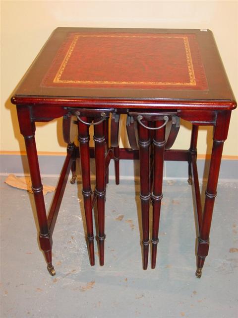 Appraisal: REGENCY STYLE MAHOGANY NESTING TABLES th century the square burgundy