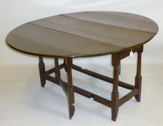 Appraisal: AN OAK GATELEG TABLE early th century the oval plank