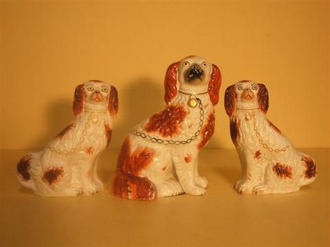 Appraisal: STAFFORDSHIRE RED AND WHITE SPANIEL Seated with gilt collar and