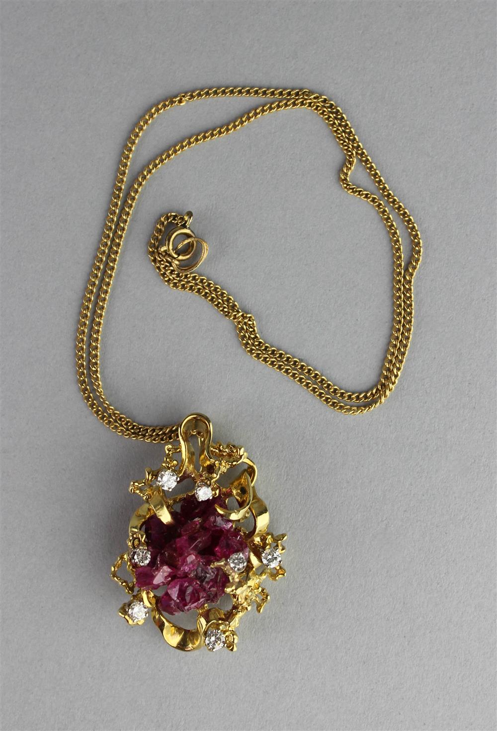 Appraisal: LADY'S RUBY AND DIAMOND PENDANT the naturalistic ruby of freeform