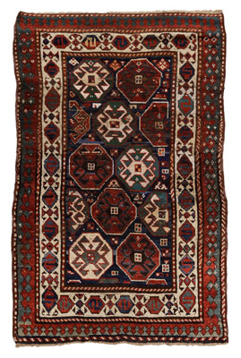 Appraisal: Kazak Rug Caucasian multiple octagonal medallions on dark-blue ground with