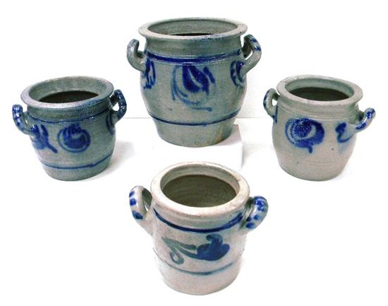 Appraisal: Four stoneware double handle crocks cobalt floral decoration interior surface