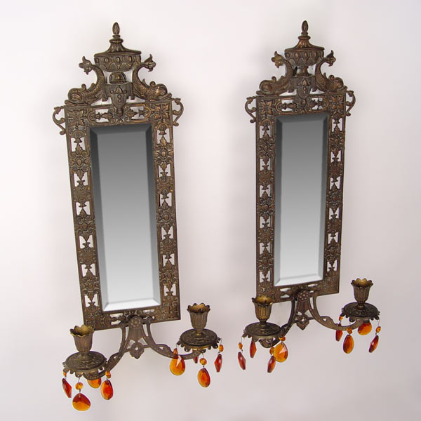 Appraisal: PAIR OF PIERCED MIRRORED SCONCES CA 'S light candle sconces