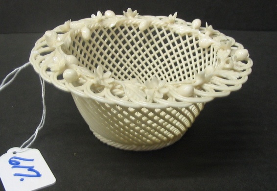 Appraisal: AN IRISH BELLEEK PARIAN BOWL the base having four strand