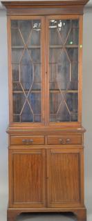 Appraisal: Georgian style mahogany three part cabinet bookcase ht in wd