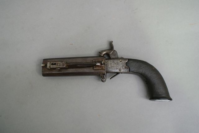 Appraisal: An English double barrel turn over percussion pistol caliber inch