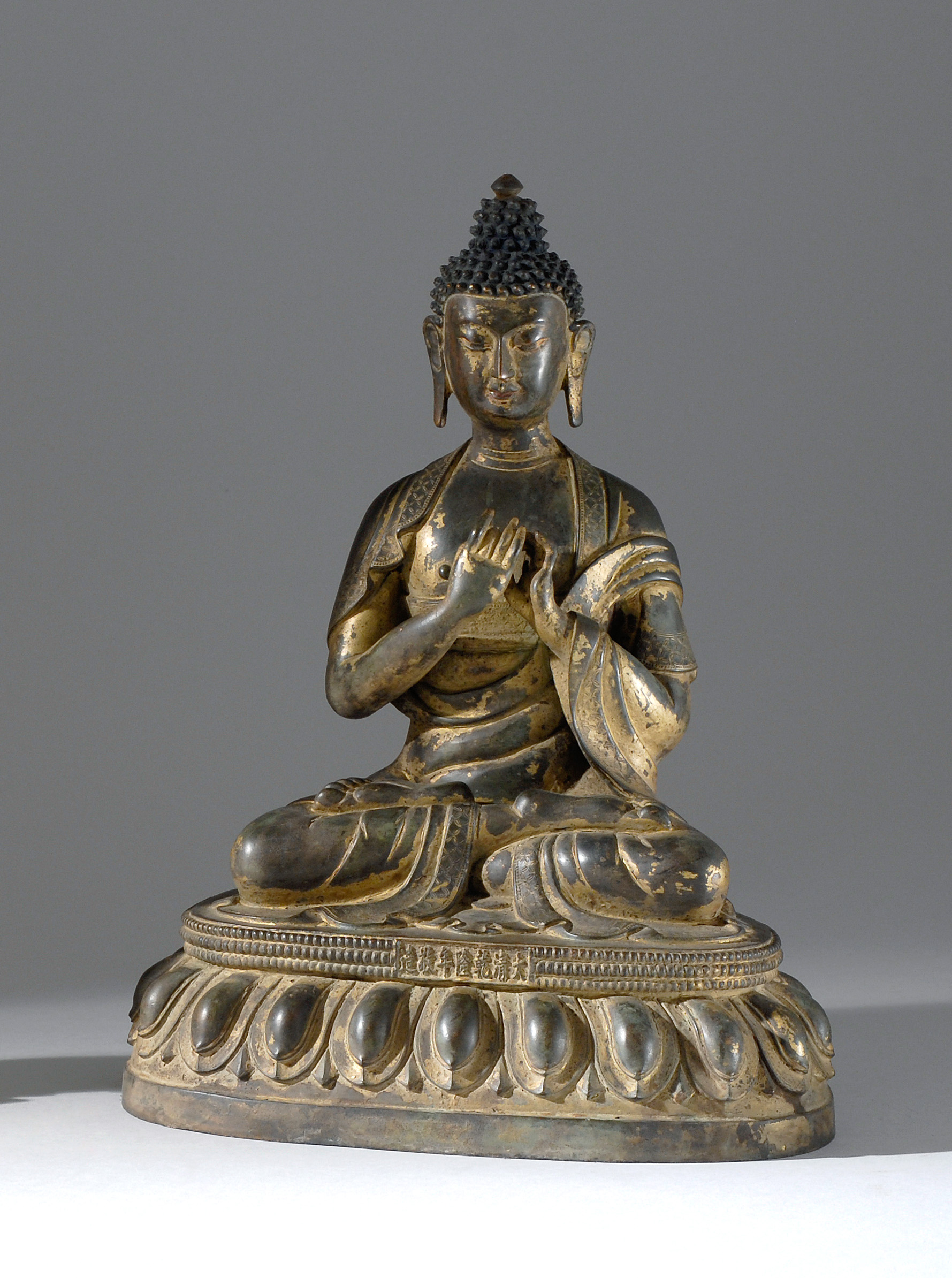 Appraisal: PARTIAL GILT-BRONZE FIGURE OF BUDDHA Seated in lotus posture on